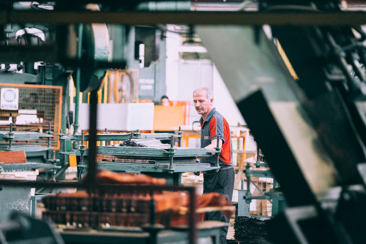 Engineer operating industrial machinery