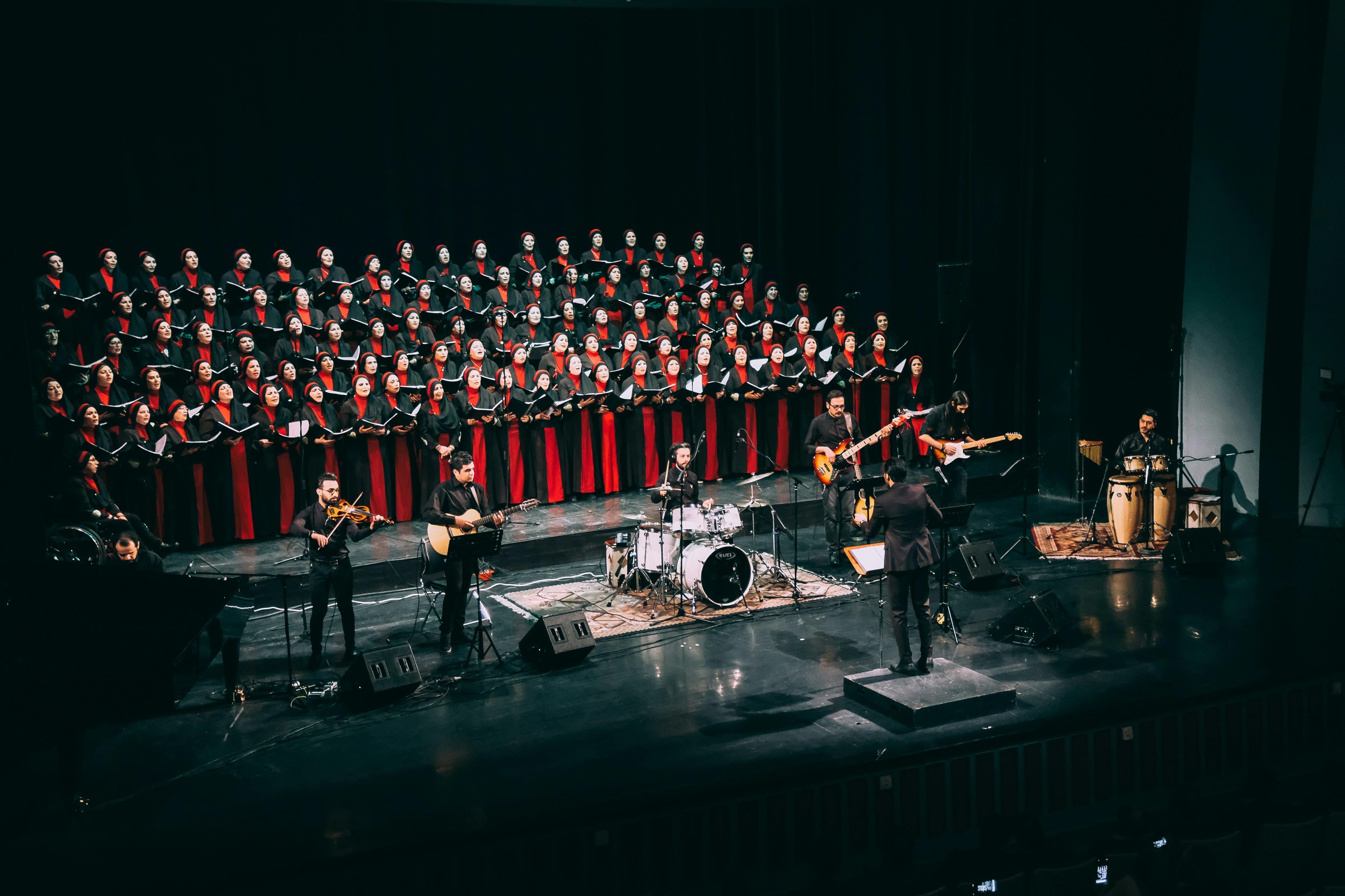 grayscale photo of microphone stands
