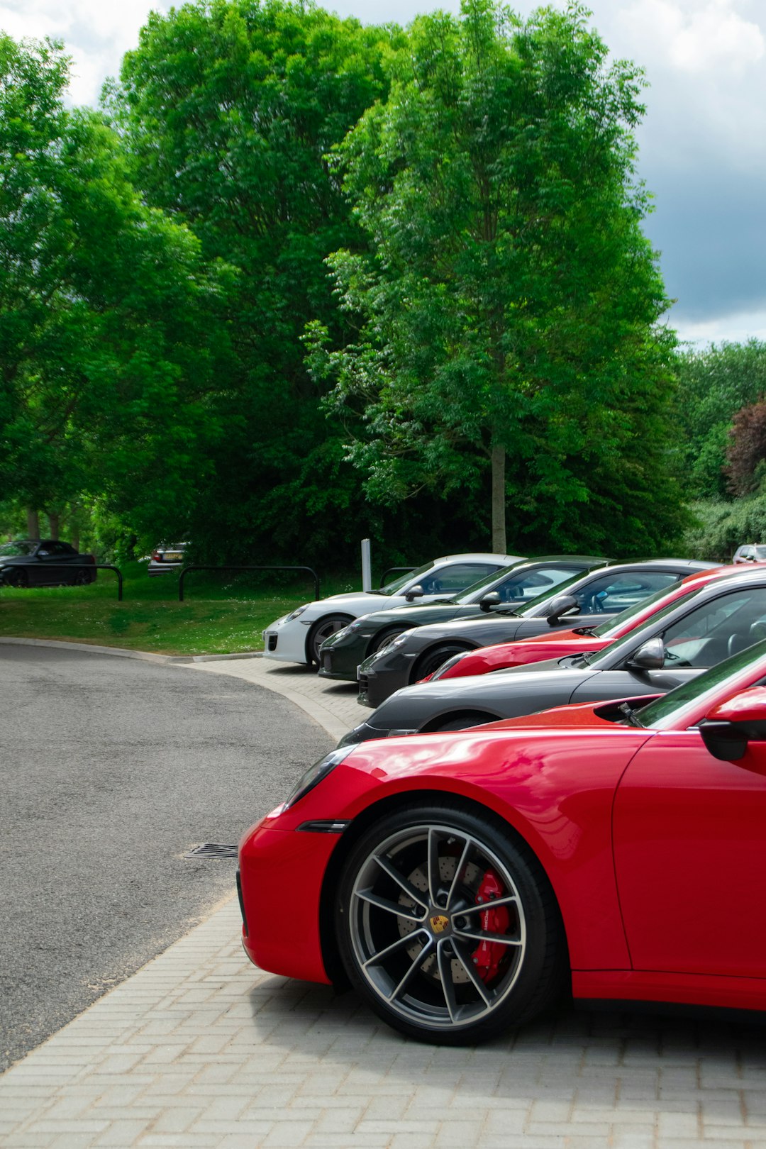 red car parked on parking lot during daytime