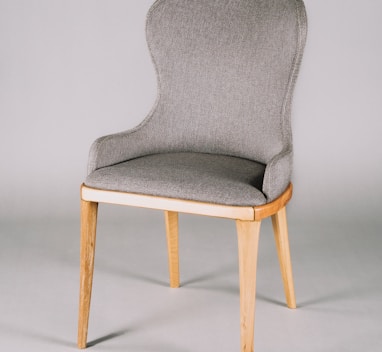 gray and white padded chair