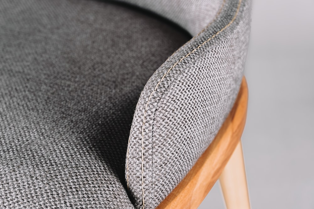 black textile on brown wooden chair