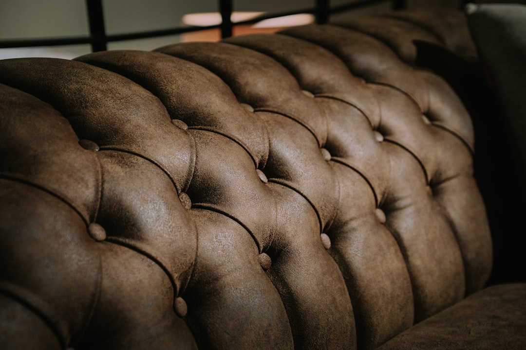 black leather tufted headboard in close up photography