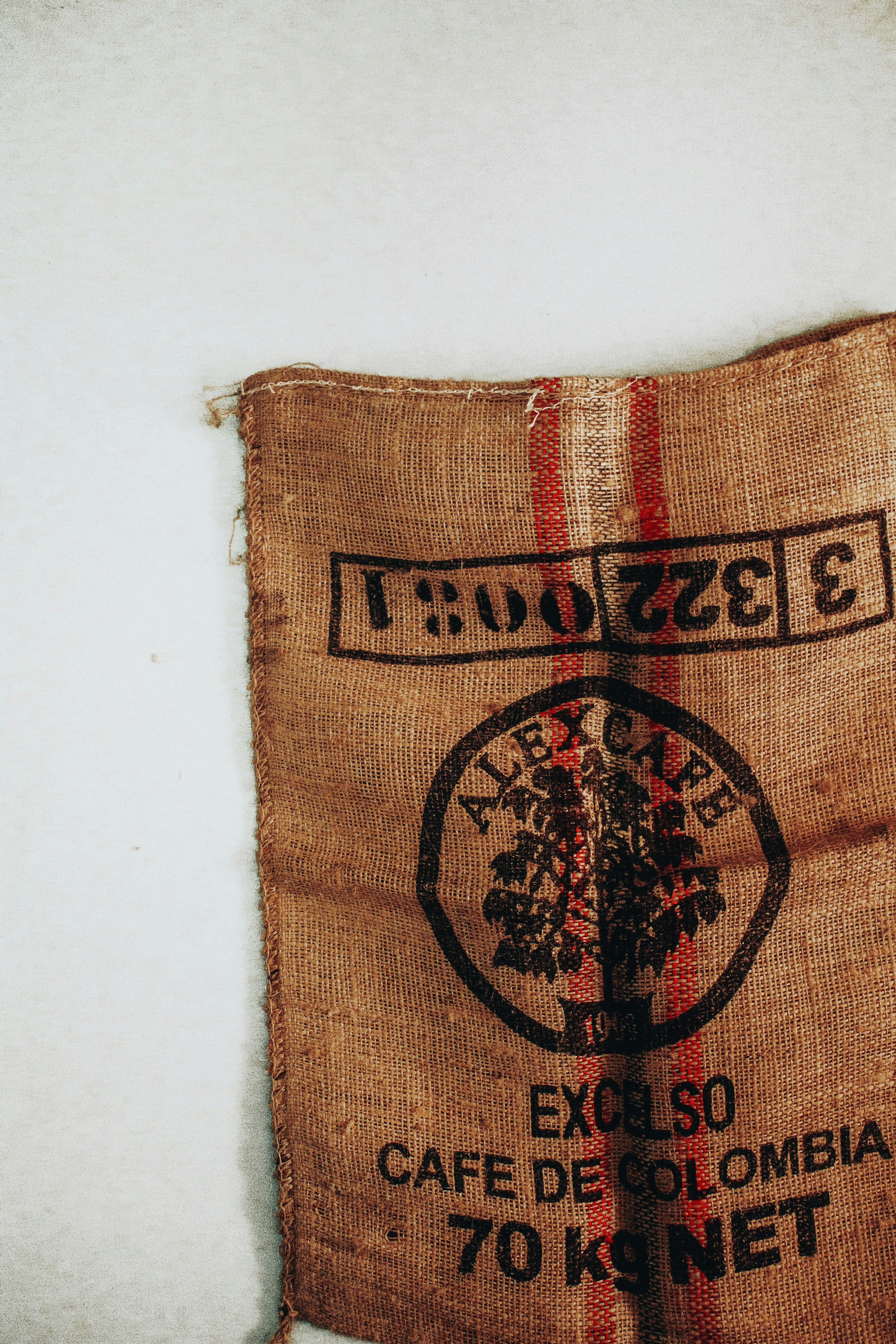 brown and red textile on white table