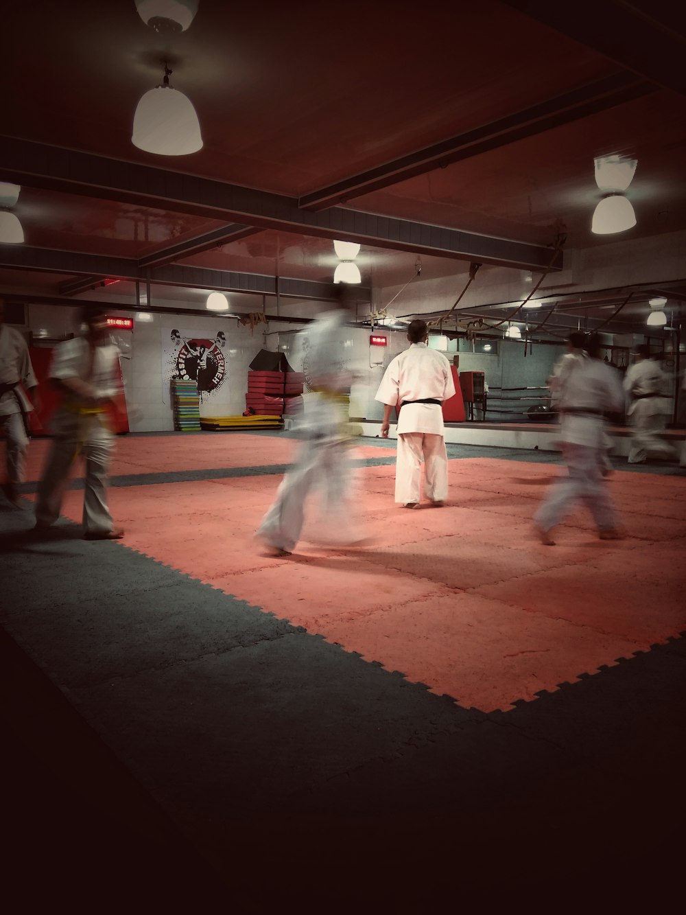 people in white and red uniform walking on red and white floor tiles