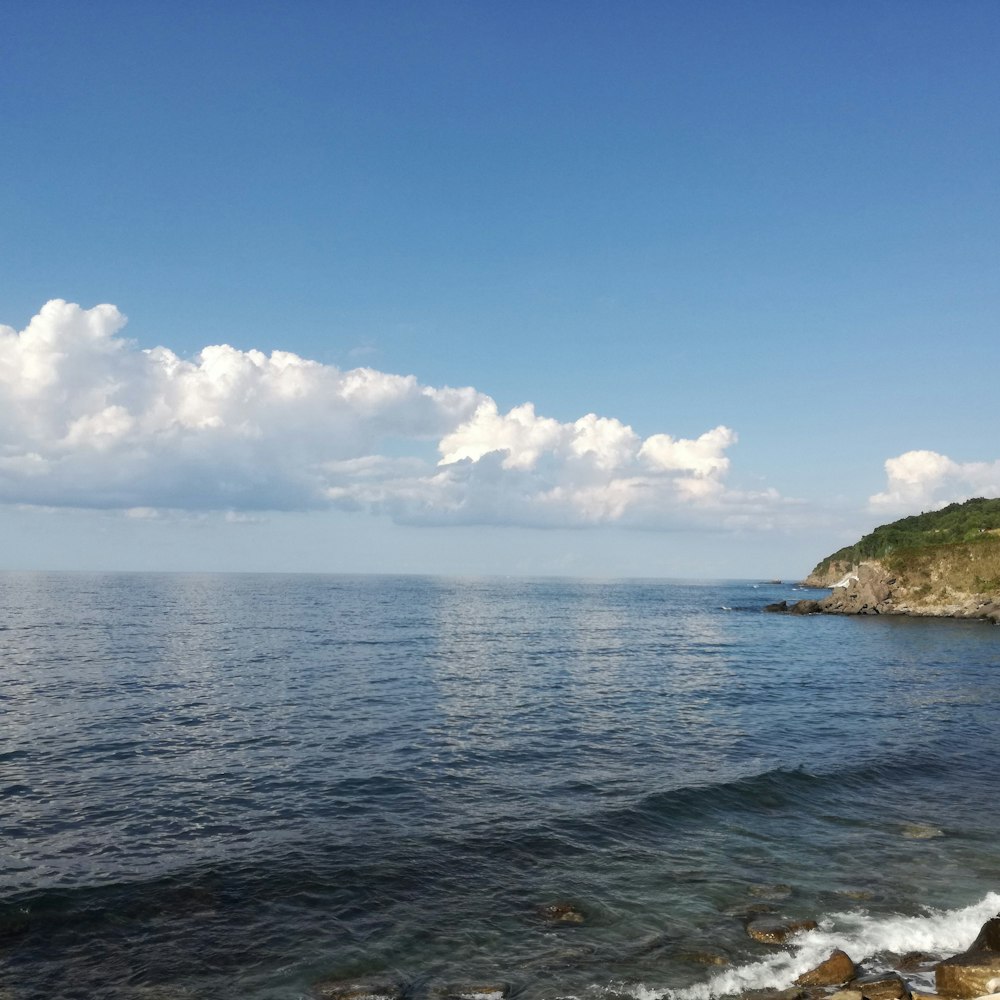 blue sea under blue sky during daytime