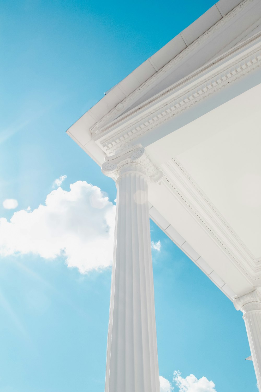 white concrete building under blue sky during daytime