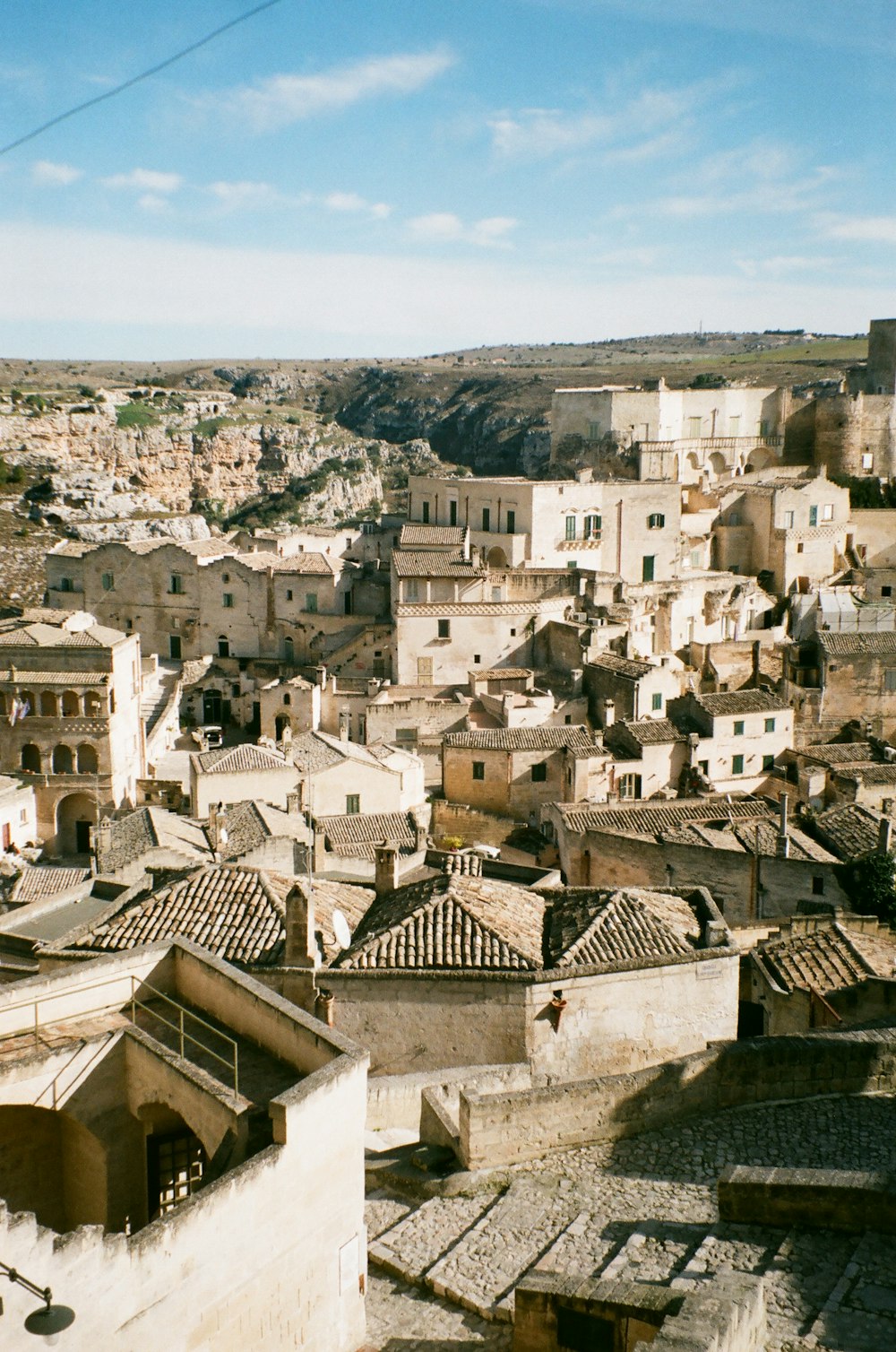 white and brown concrete houses near mountain during daytime