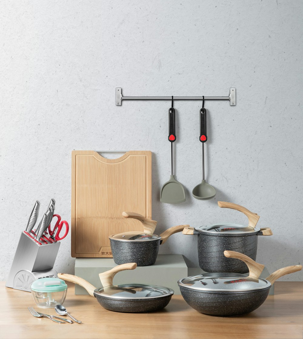 stainless steel cooking pot on brown wooden table