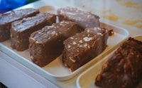 chocolate cake on white plastic container