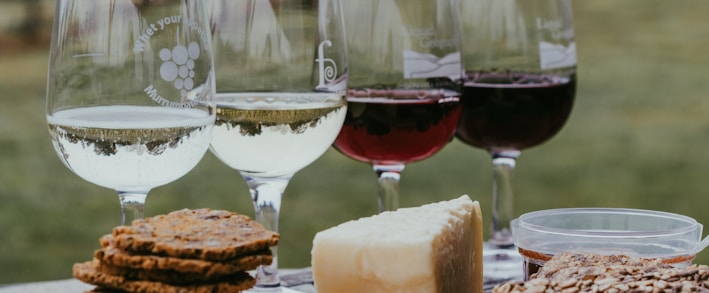 clear wine glass with red wine on table