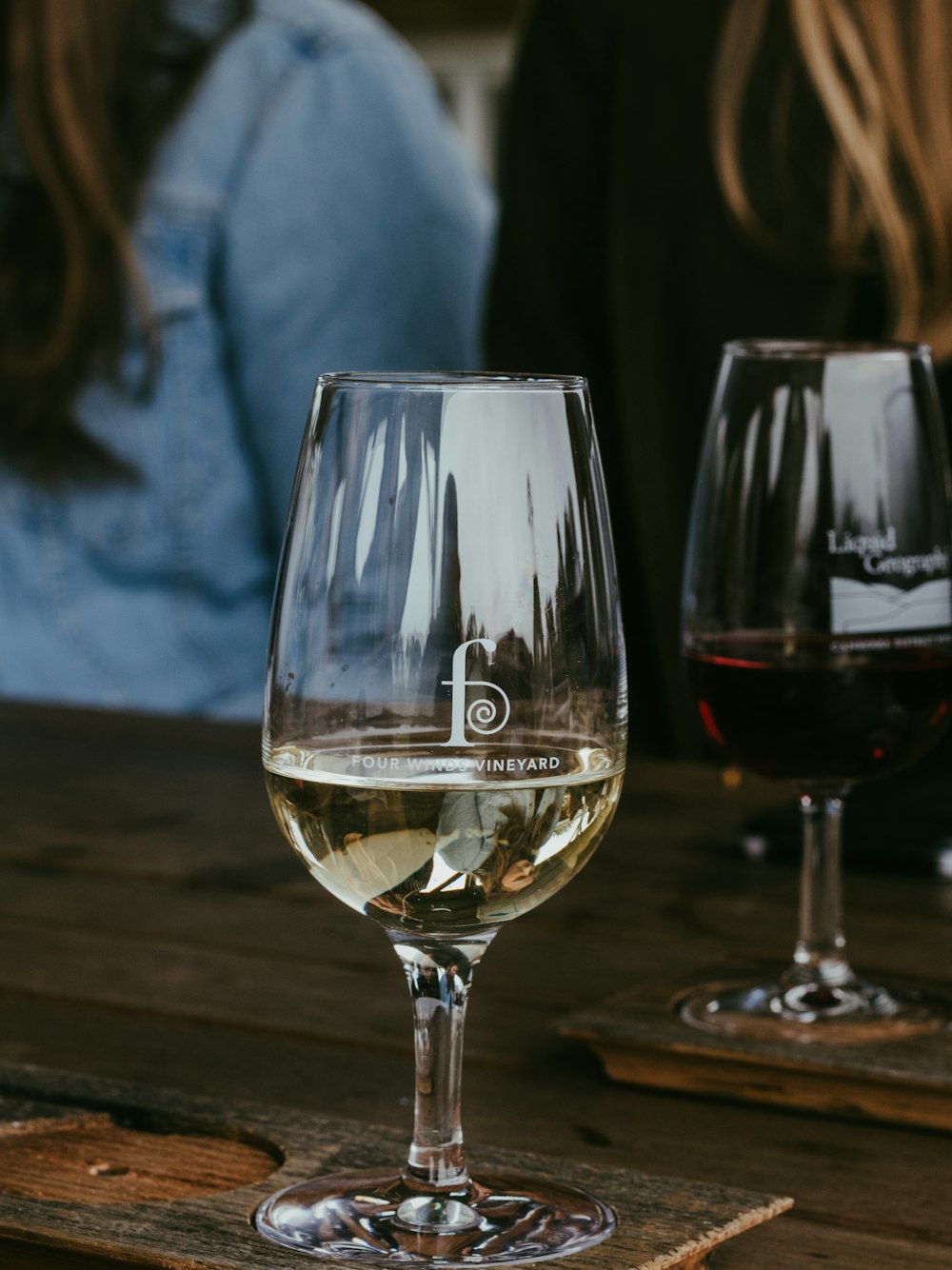 clear wine glass on brown wooden table