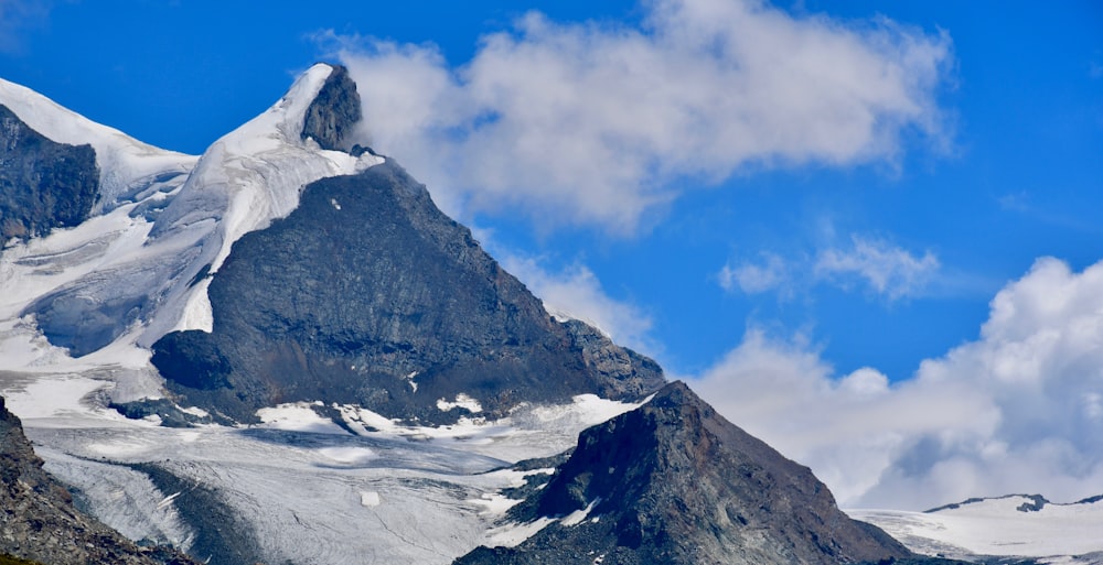 snow covered mountain under blue sky during daytime