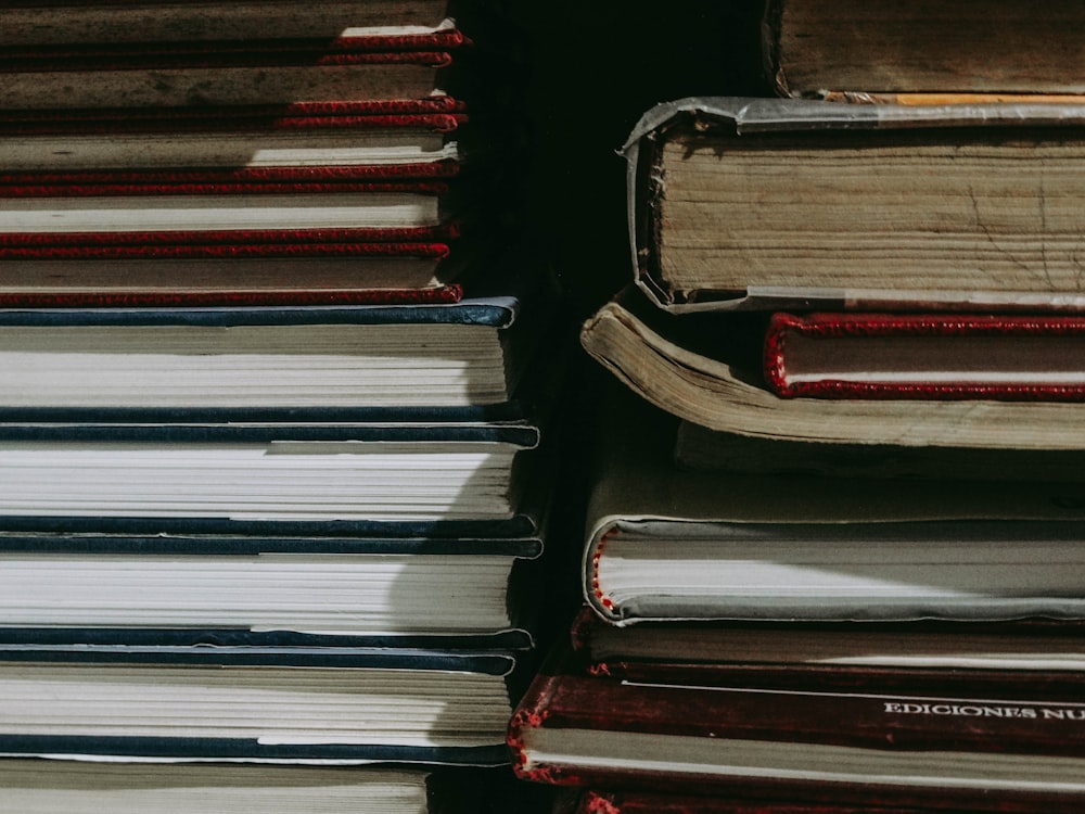 stack of books on black surface