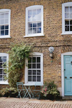 brown brick house with white wooden door