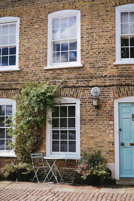 Front view of a charming Hoboken house featuring large, clean window frames replaced by Hoboken Window Pros.
