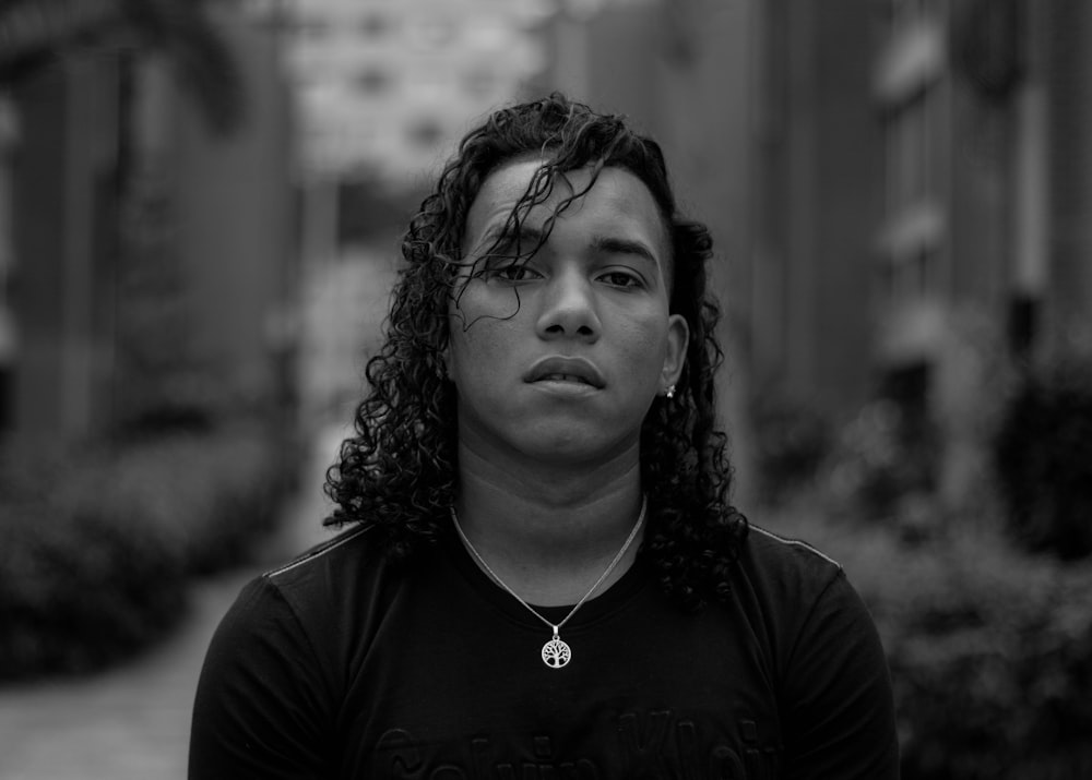 woman in black shirt in grayscale photography