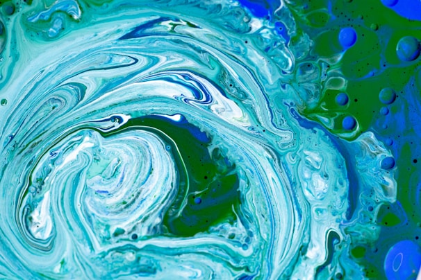 Abstract colorful marbles arranged in a spiral pattern symbolizing creative thinking.