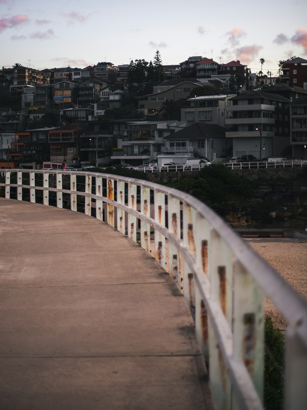 white wooden bridge over city during daytime