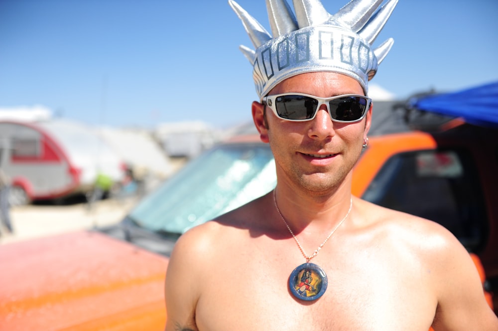 man wearing black sunglasses and silver crown