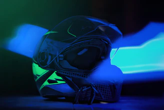 Close-up of a sleek gaming motorcycle helmet with vibrant LED accents