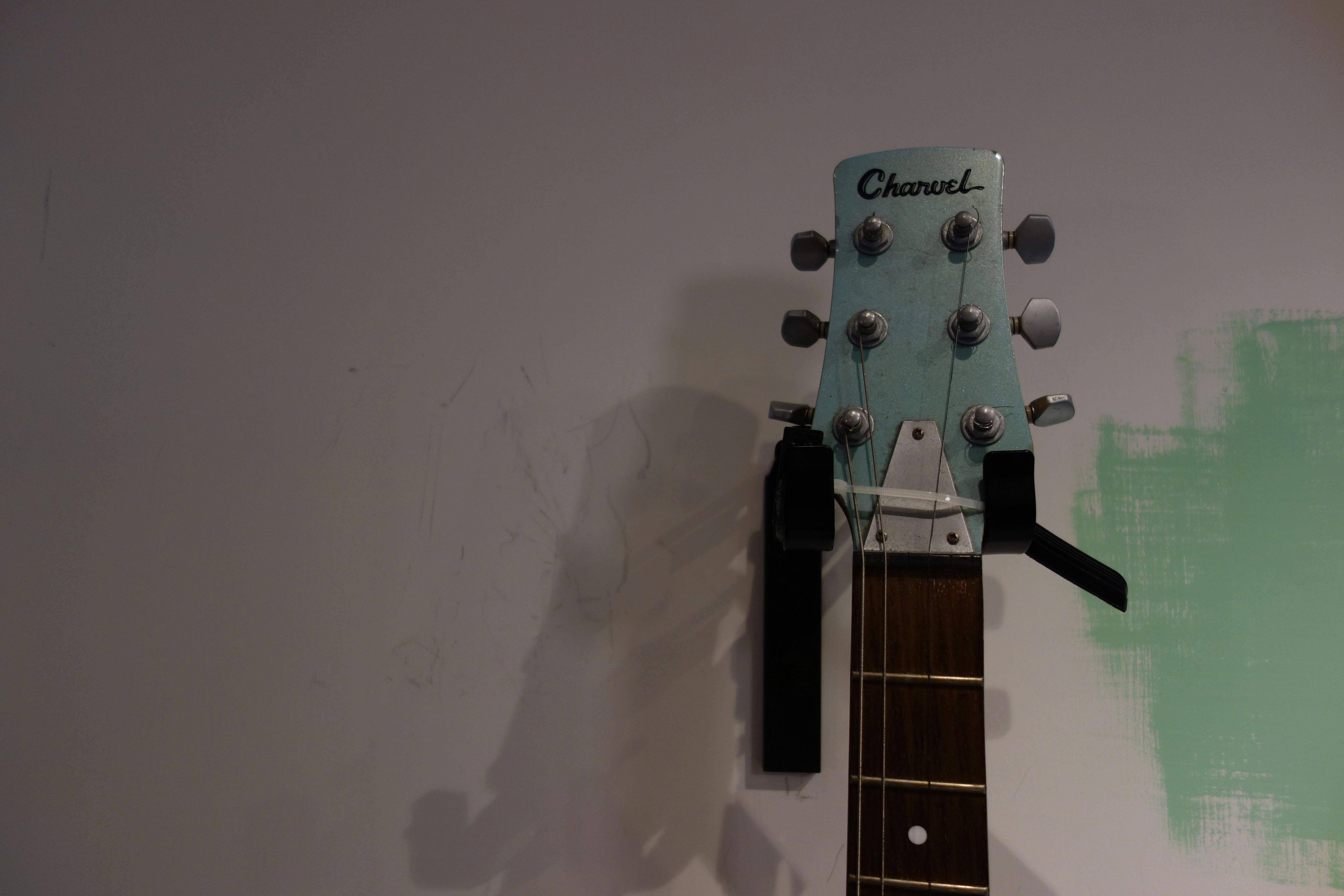 white and black guitar headstock