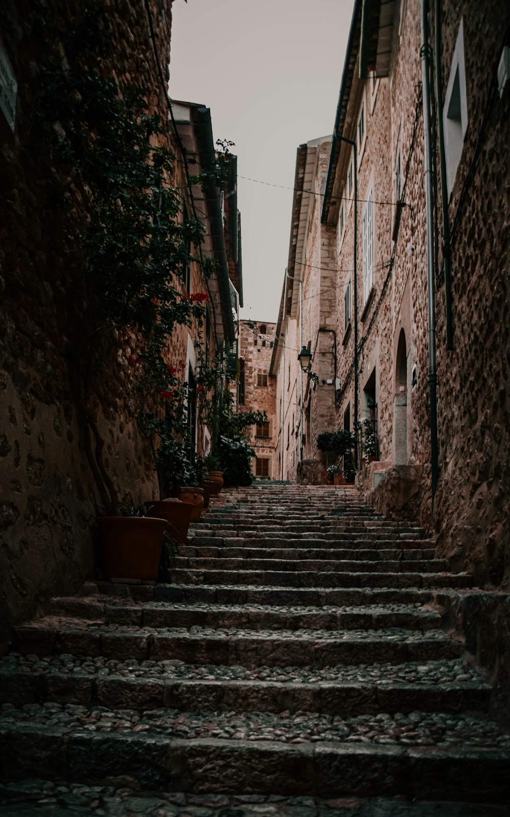 brown wooden chairs on gray concrete stairs