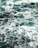 Waves of the ocean create a turbulent pattern on the water's surface, with foamy white crests contrasting against the deep teal of the sea.
