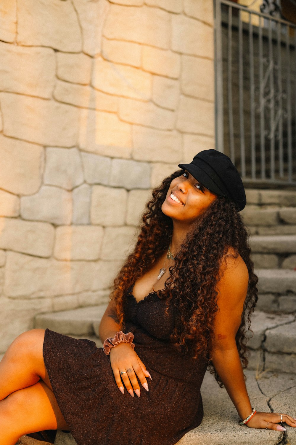 woman in black cap and black sleeveless top