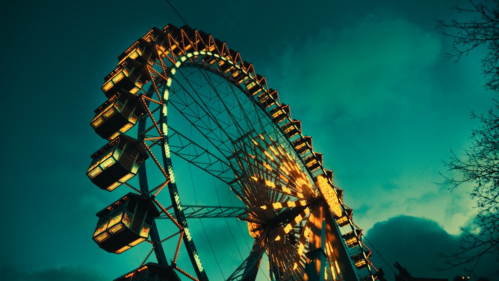 brown and black ferris wheel under blue sky during daytime