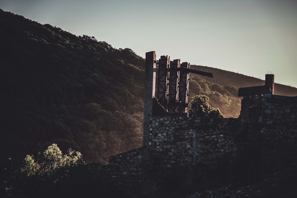 brown concrete building on mountain