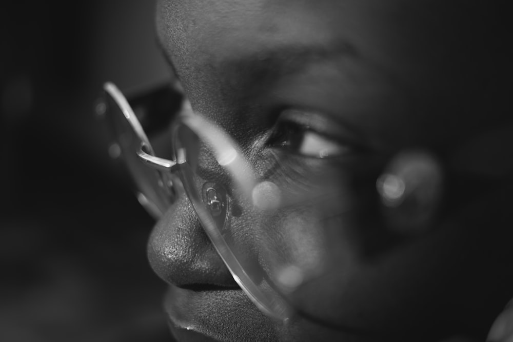 grayscale photo of person wearing eyeglasses