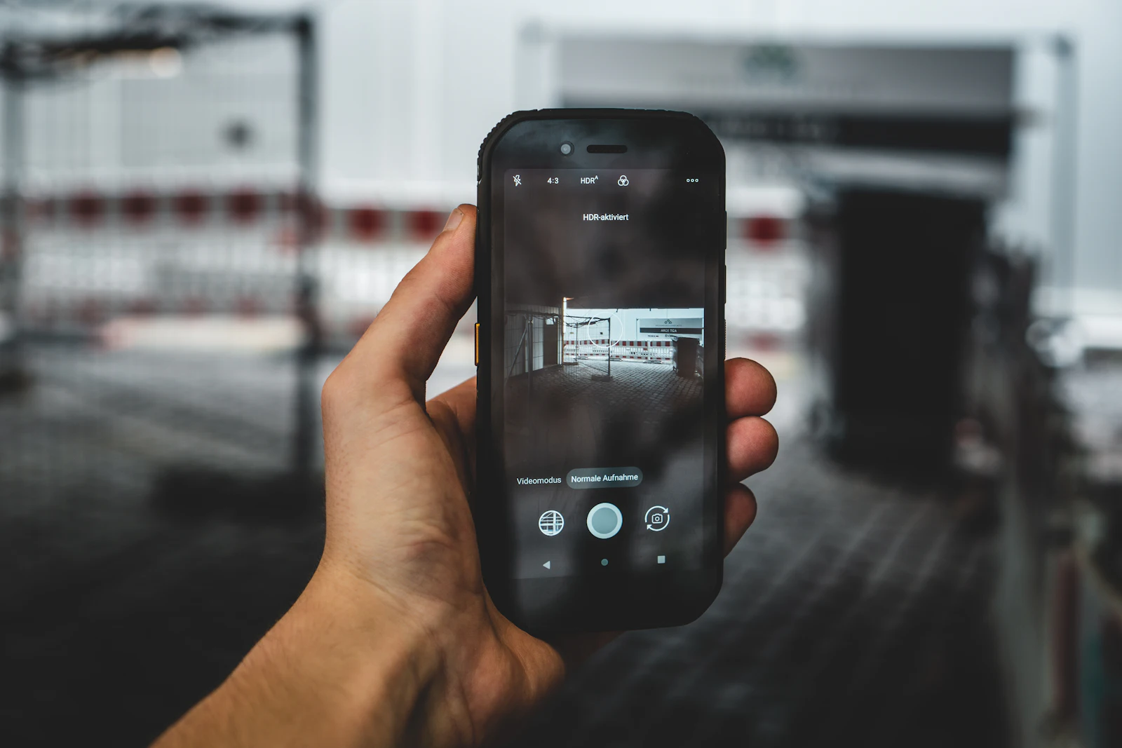 Person holding a rugged outdoor smartphone