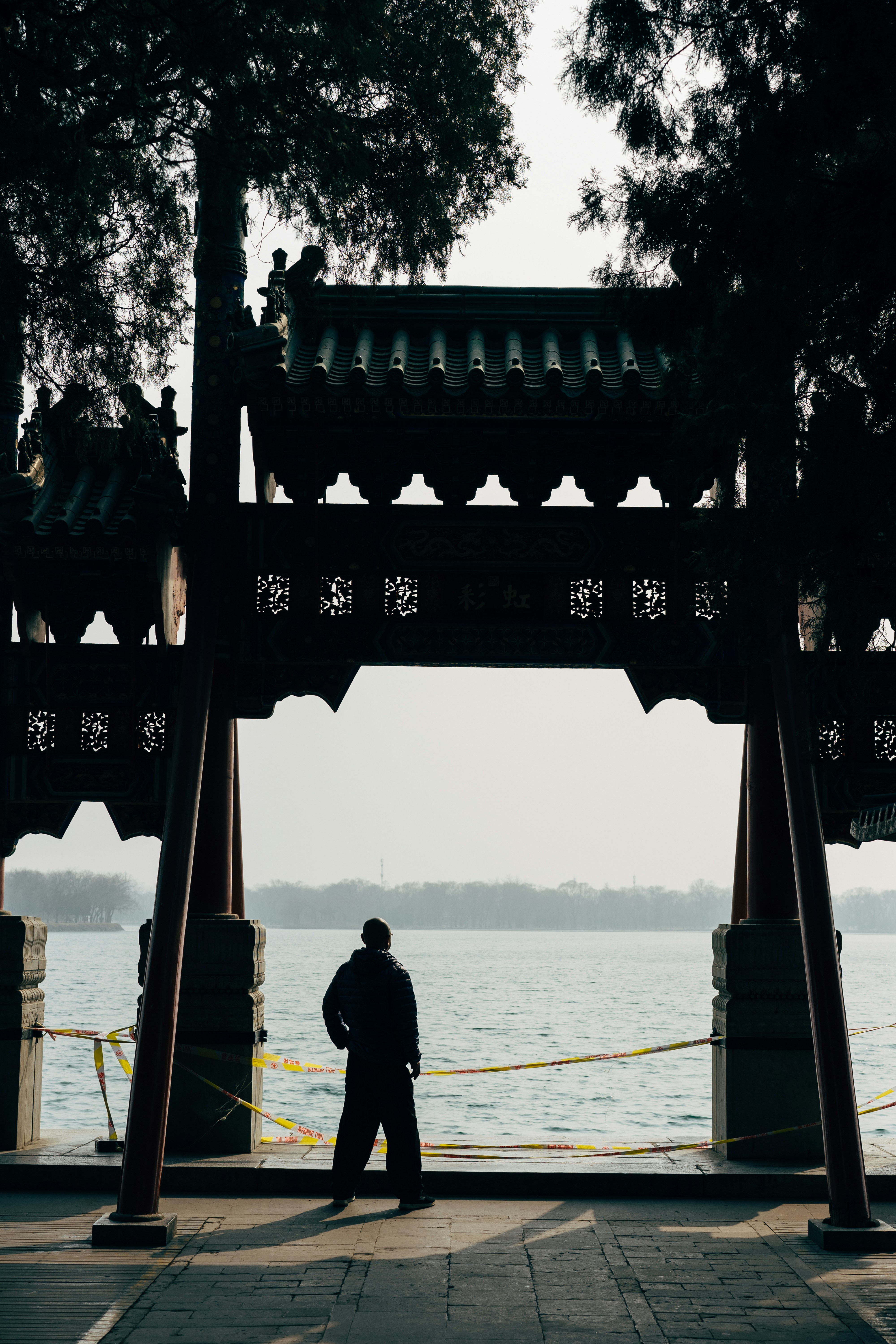man in black jacket standing on boat during daytime