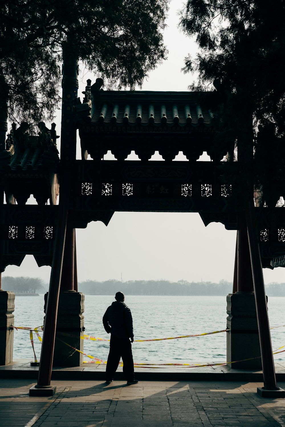 man in black jacket standing on boat during daytime