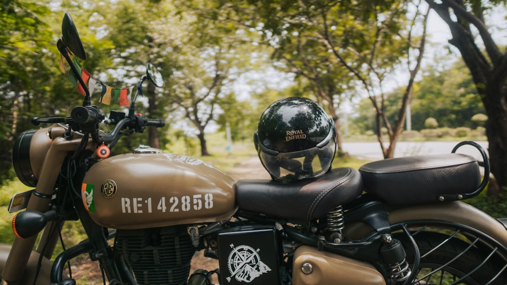 black and red motorcycle near green trees during daytime