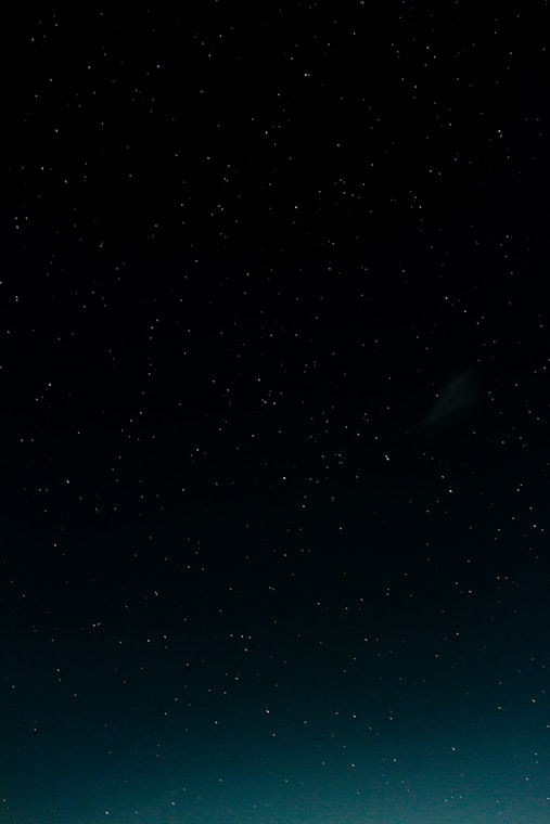 black and blue starry night sky
