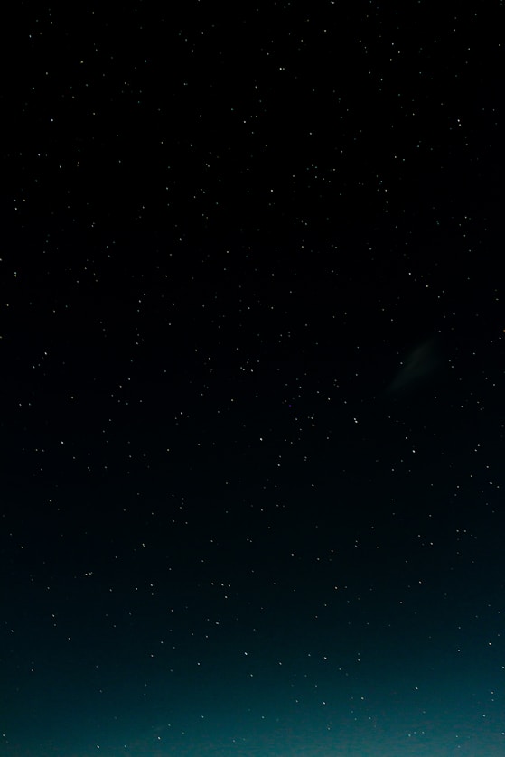 black and blue starry night sky