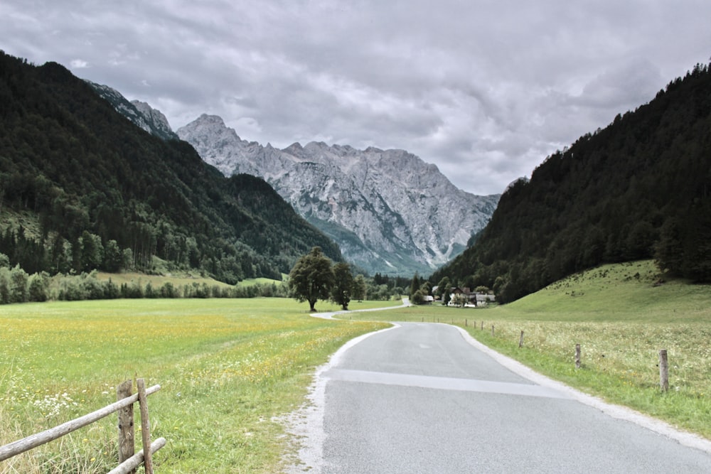 green grass field near mountain during daytime