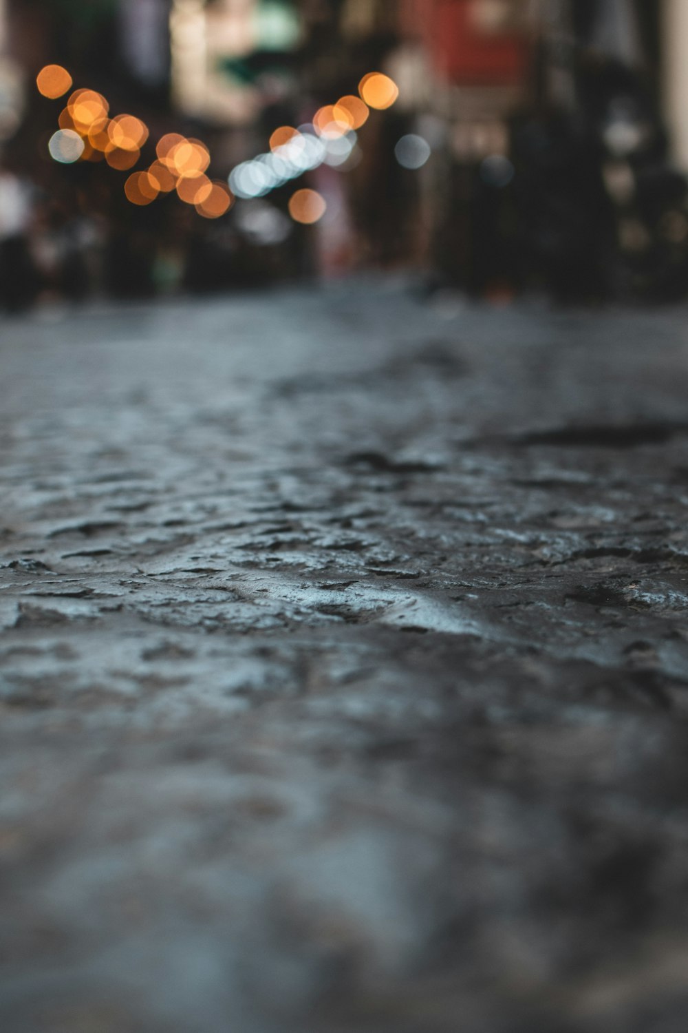 bokeh photography of gray concrete floor