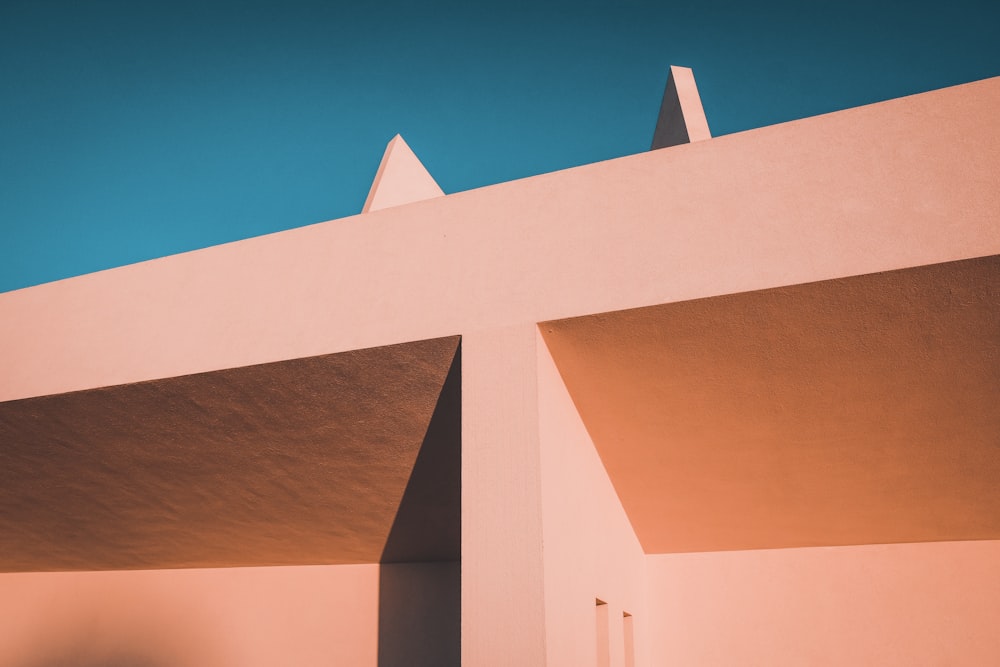 brown concrete building under blue sky during daytime