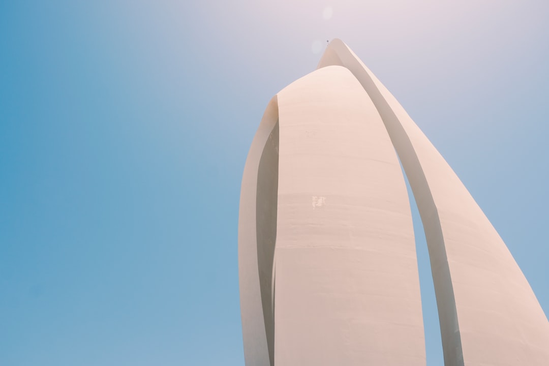 white concrete building under blue sky during daytime