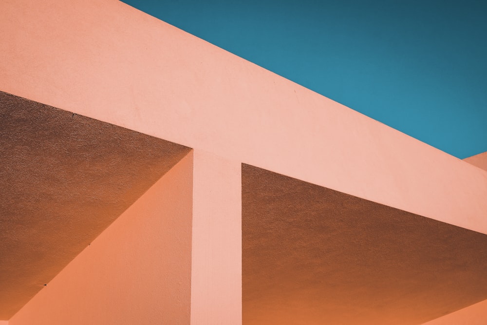 orange and white concrete building under blue sky during daytime