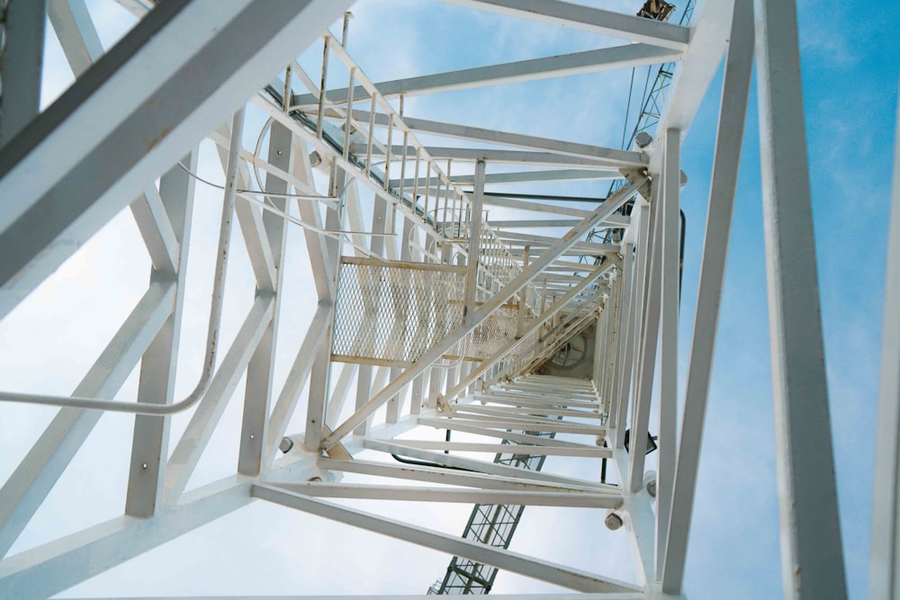 white metal ladder on white wall