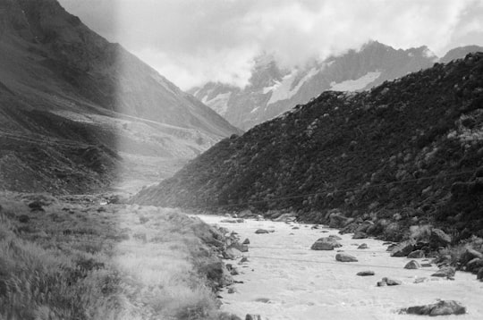 grayscale photo of mountains and trees in Mt Cook New Zealand