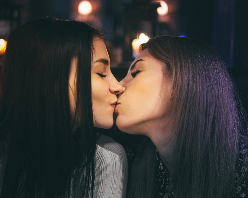 Two women sharing kiss