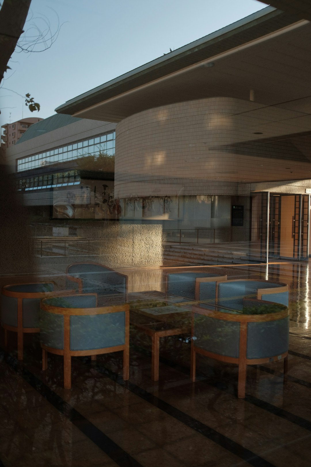 brown wooden table and chairs near swimming pool