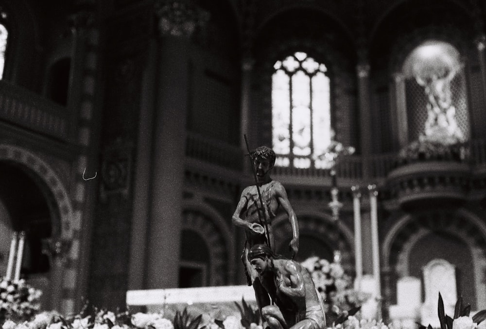 grayscale photo of man playing guitar