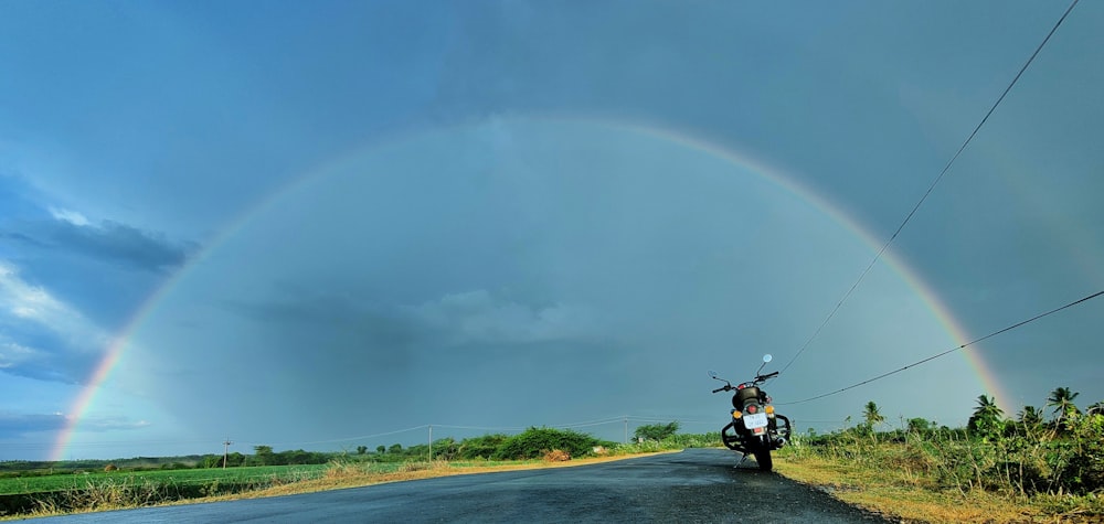 man riding motorcycle on road during daytime