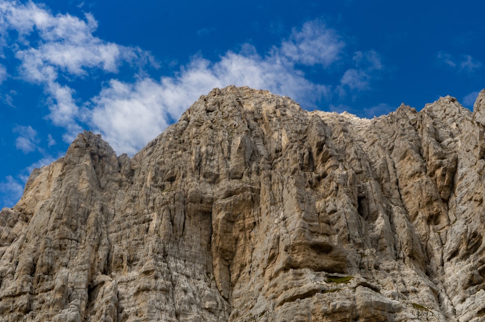 brown rocky mountain under blue sky during daytime