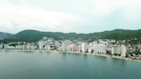 city buildings near body of water during daytime